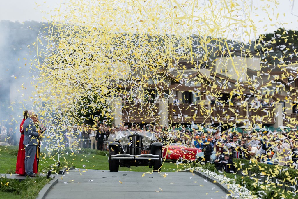 The black 1935 Duesenberg SSJ Special Speedster beneath gold confetti after winning Best of Show at Pebble Beach in 2026