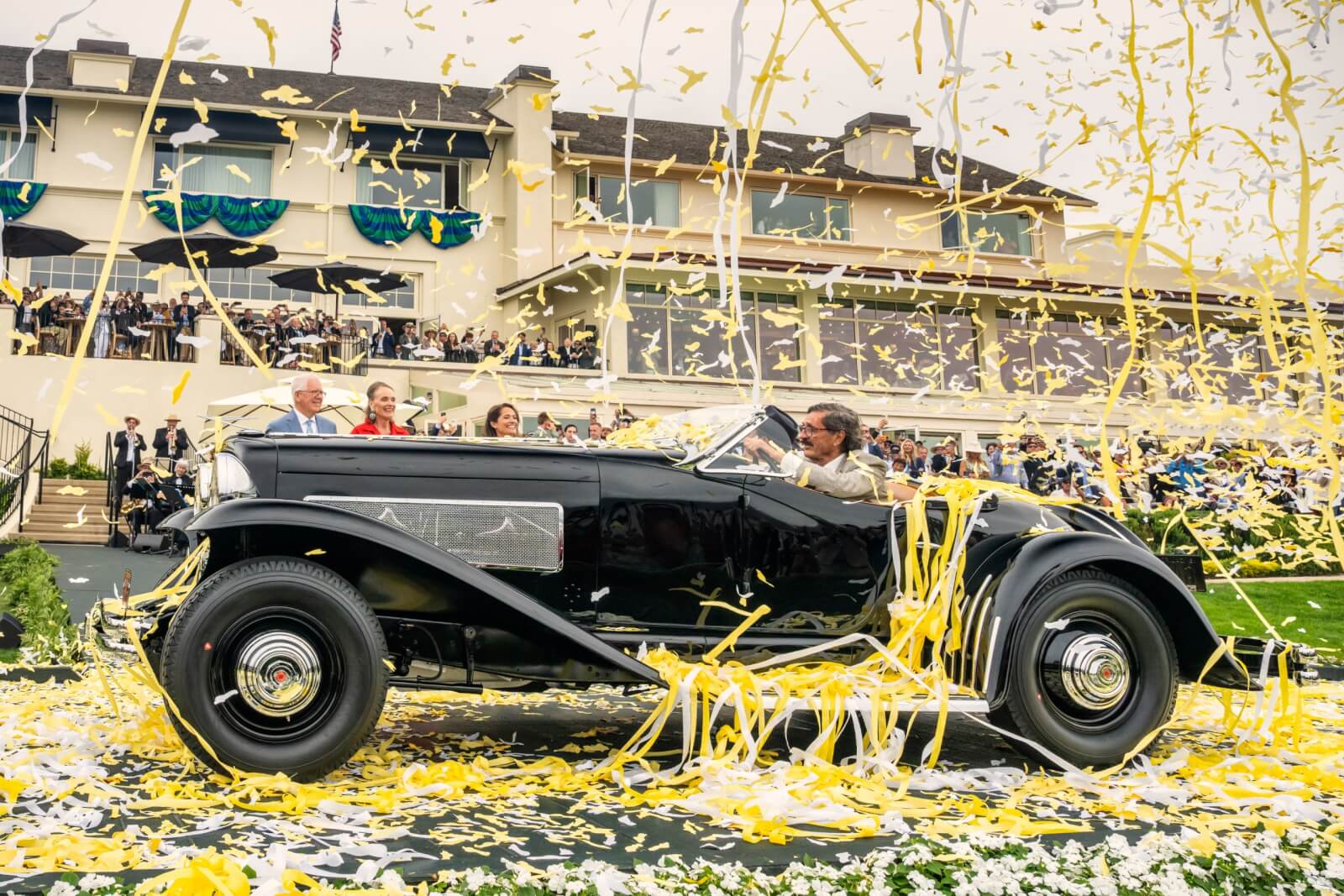 The 1935 Duesenberg SSJ Special Speedster celebrating its Best of Show victory at the 75th Pebble Beach Concours d’Elegance