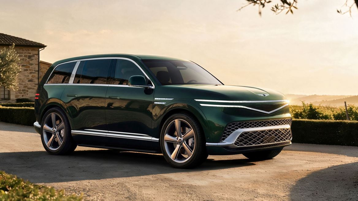 Green Genesis GV90 electric flagship SUV in a front three-quarter view on a stone terrace at sunset.