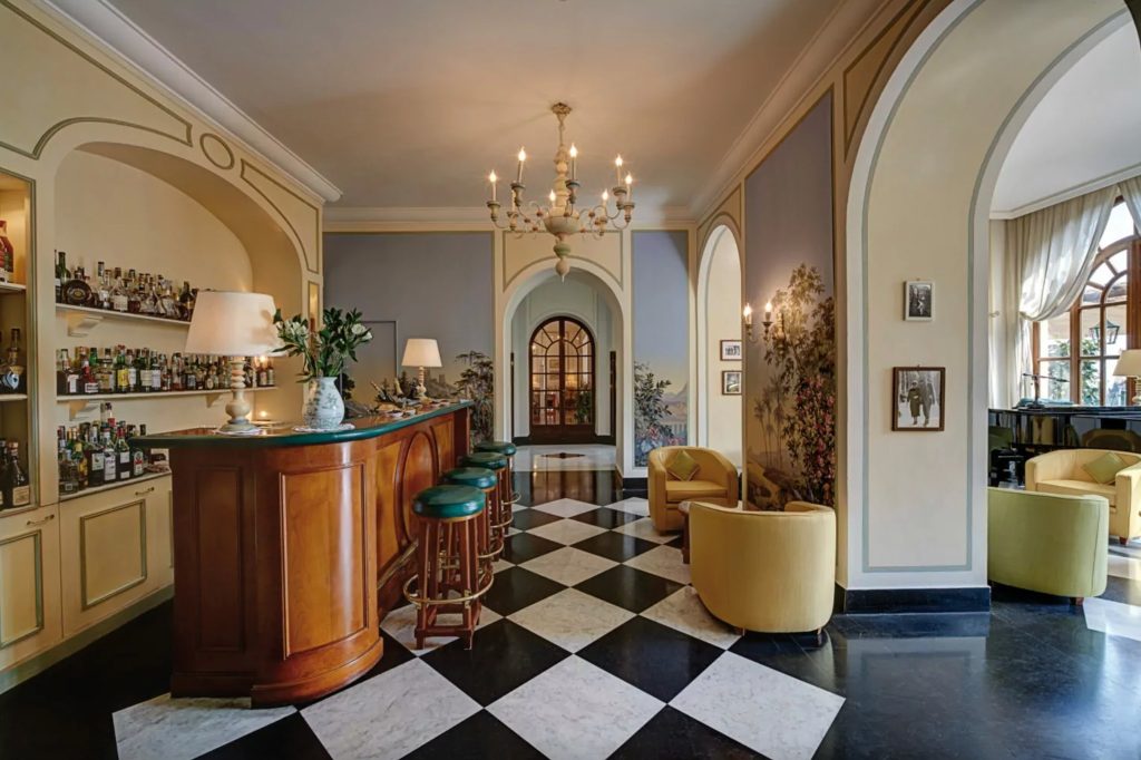 Splendido interior with classic bar, chandelier and elegant residential detailing.