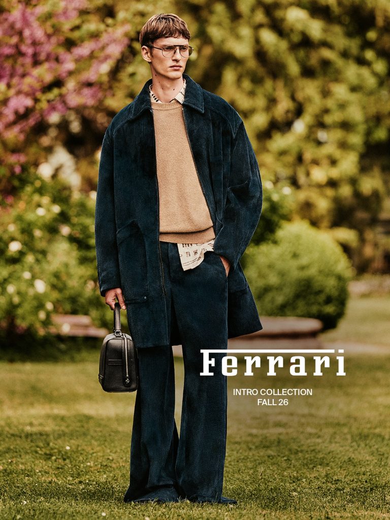 Tammo Rahming wearing deep petrol corduroy and camel knitwear in Ferrari’s Pre-Fall 2026 campaign.