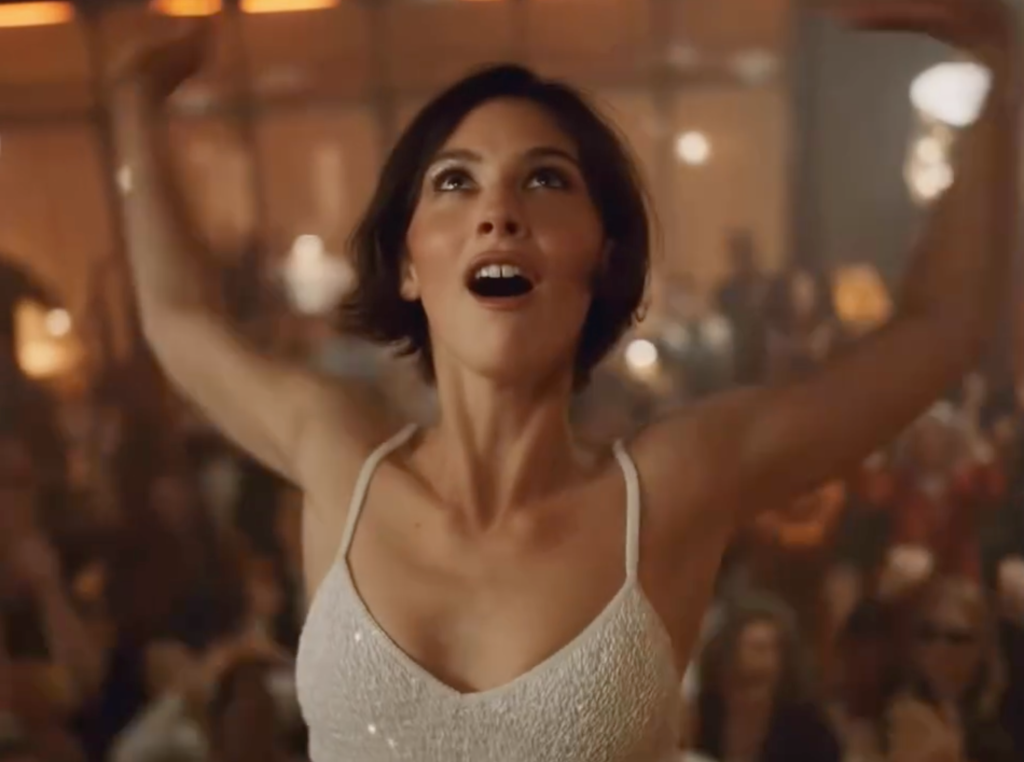 Gracie Abrams dancing inside Café Mademoiselle in the CHANEL fragrance campaign