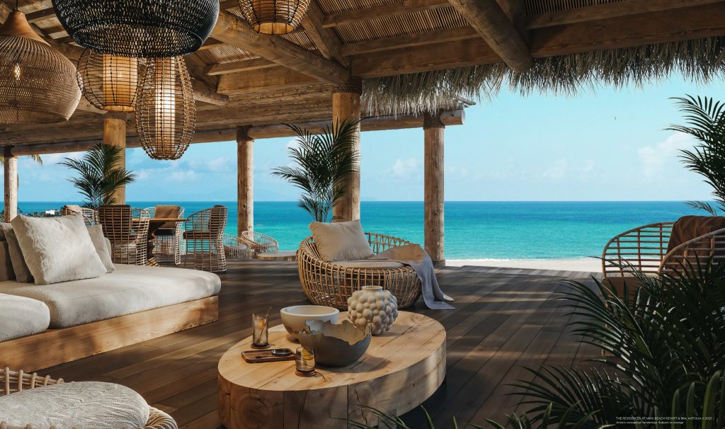 Open-air beachfront lounge at Nikki Beach Resort and Spa Antigua with natural timber finishes and panoramic sea views.