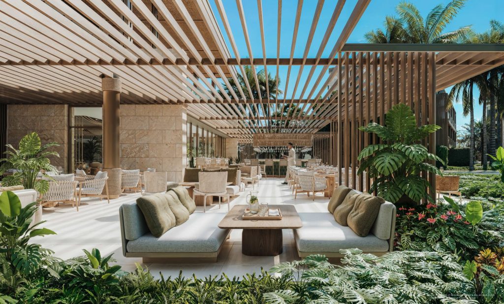 Garden restaurant and lounge at Nikki Beach Resort and Spa Antigua framed by tropical planting and architectural timber screens.