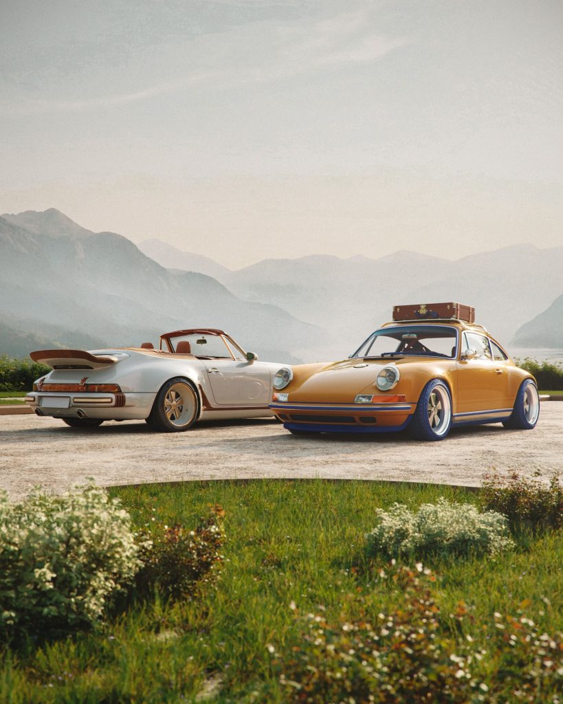 The Louis Vuitton and Singer Classic Turbo cabriolet and saffron Classic coupe displayed together against a mountain landscape.