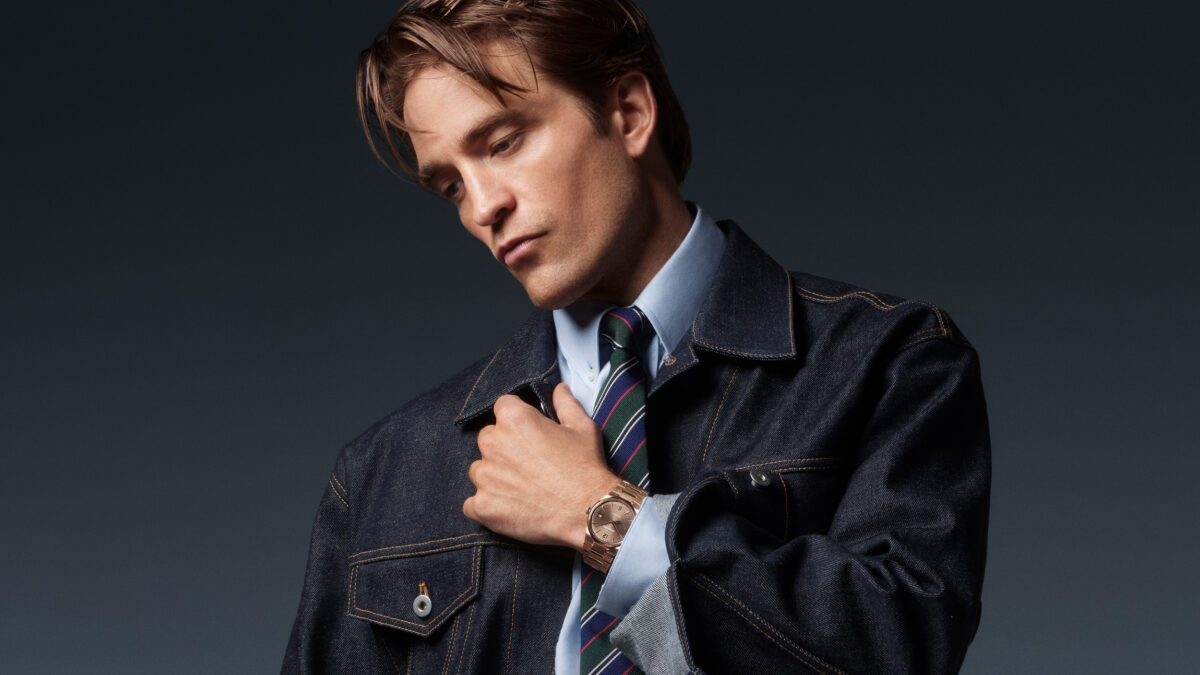 Robert Pattinson in dark denim and tailoring wearing the 18K pink-gold Jaeger-LeCoultre Master Control Chronometre Perpetual Calendar.
