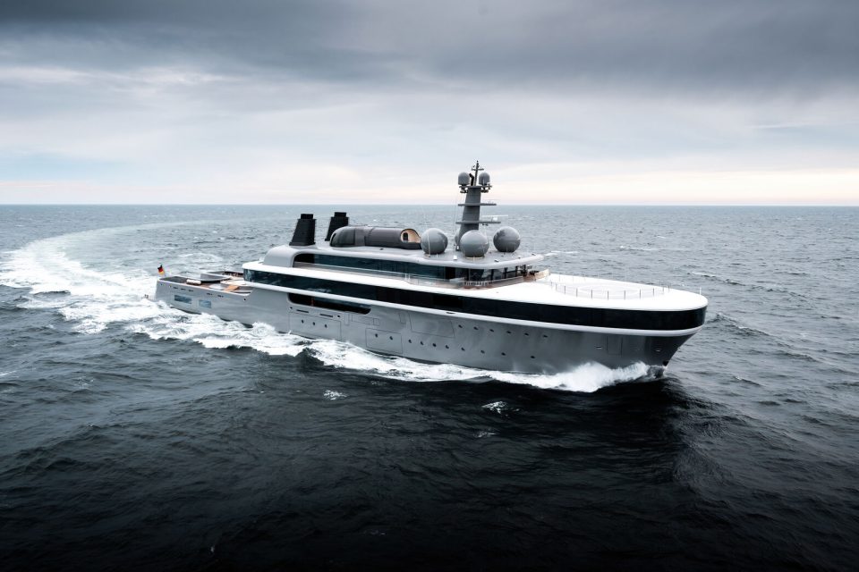 NAUSICAÄ cruising at sea, revealing Marc Newson’s flowing exterior design and wraparound glass.