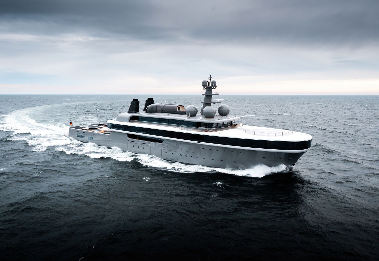 NAUSICAÄ cruising at sea, revealing Marc Newson’s flowing exterior design and wraparound glass.