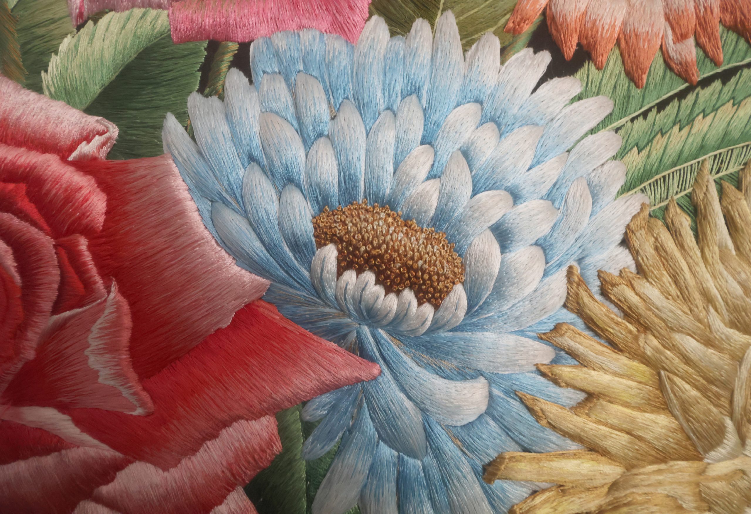 Silk flowers in Shams Uddin The Vase, showing the depth and detail of the hand embroidery.