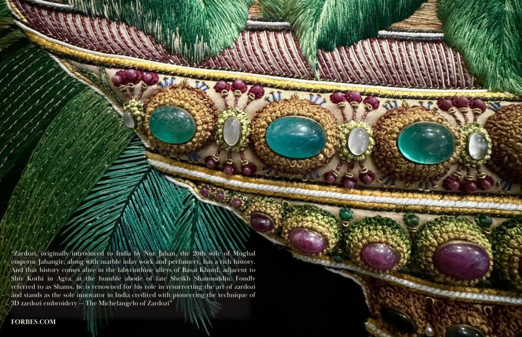 Detail of the jewelled vessel and silk leaves in The Vase, with a supplied quotation attributed to Forbes.