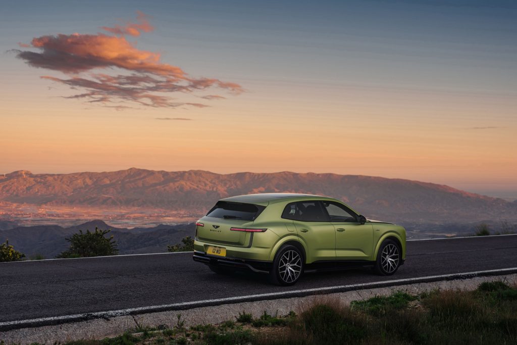 Bentley Torcal viewed from the rear against a sunset mountain landscape.