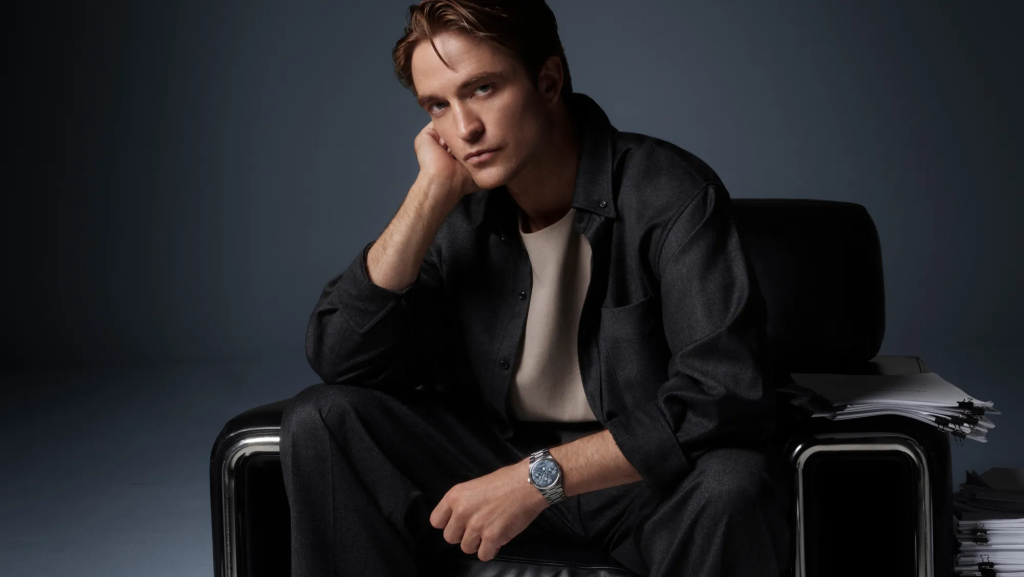 Robert Pattinson seated in the Jaeger-LeCoultre campaign wearing the stainless-steel Master Control Chronometre Perpetual Calendar.