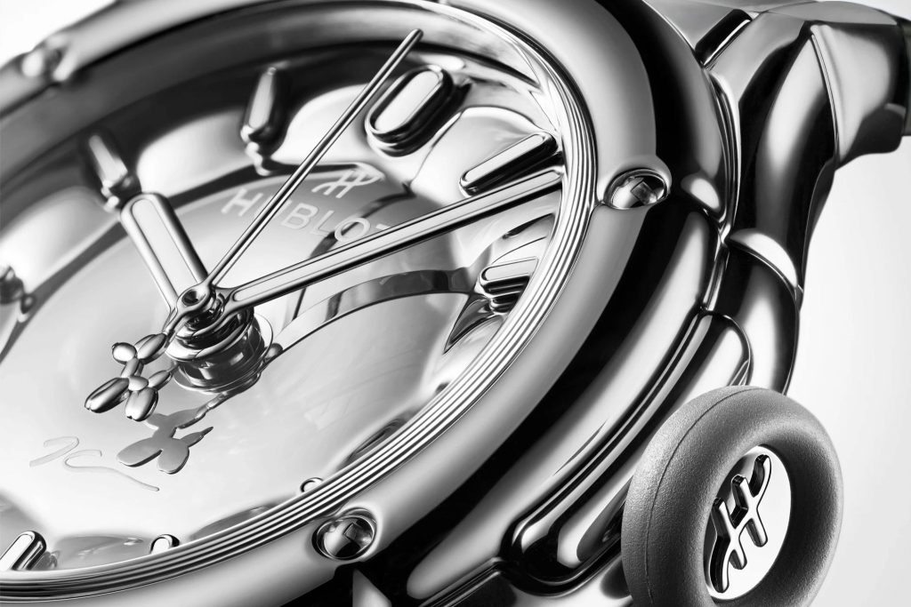 Close view of the mirror-polished silver dial and Balloon Dog seconds-hand counterweight.