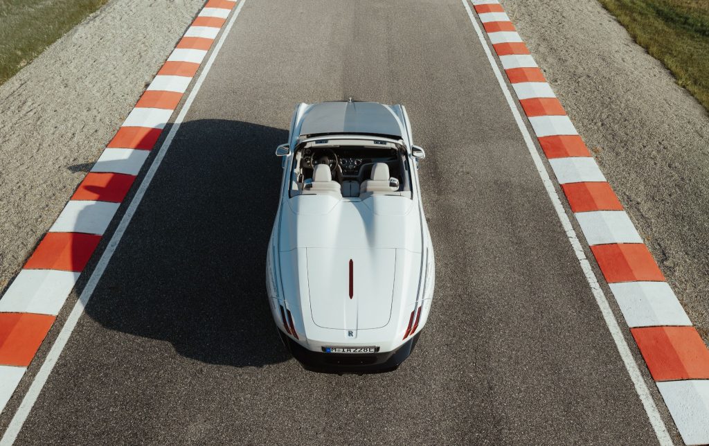Overhead view of a white Rolls-Royce Project Nightingale prototype on a test circuit