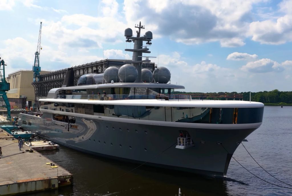 Close view of NAUSICAÄ during construction, highlighting the extensive upper-deck glazing.