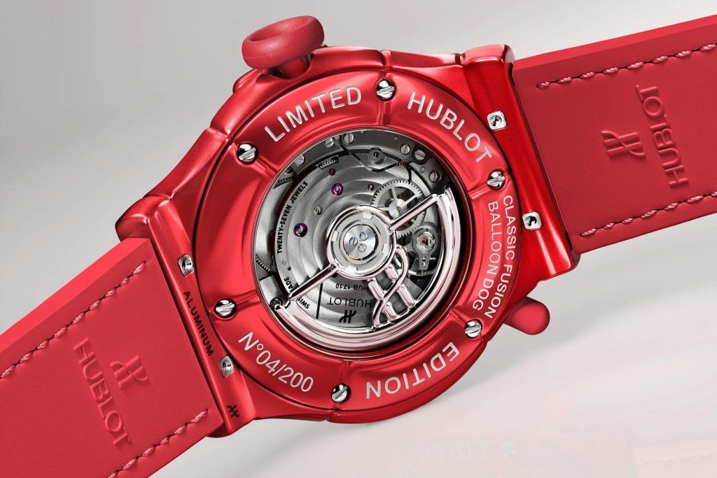 Caseback of the red edition revealing the automatic movement and sculptural rotor.
