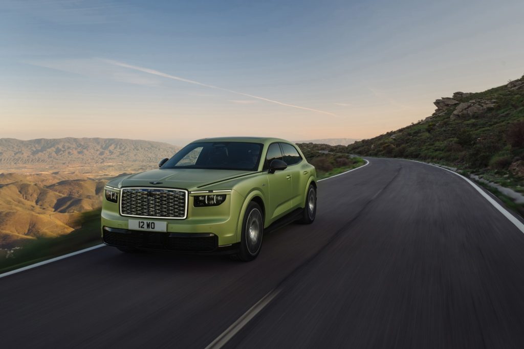 Front three-quarter view of the Bentley Torcal on a mountain road.
