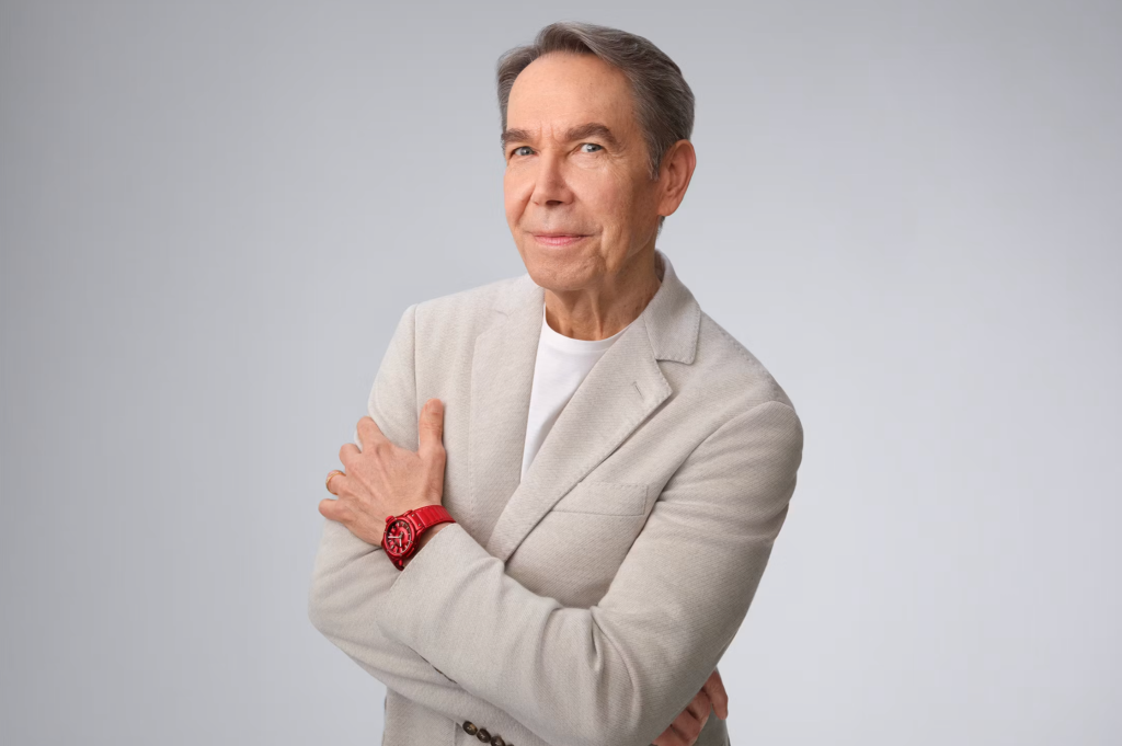 Portrait of Jeff Koons wearing the red Hublot Classic Fusion Balloon Dog.
