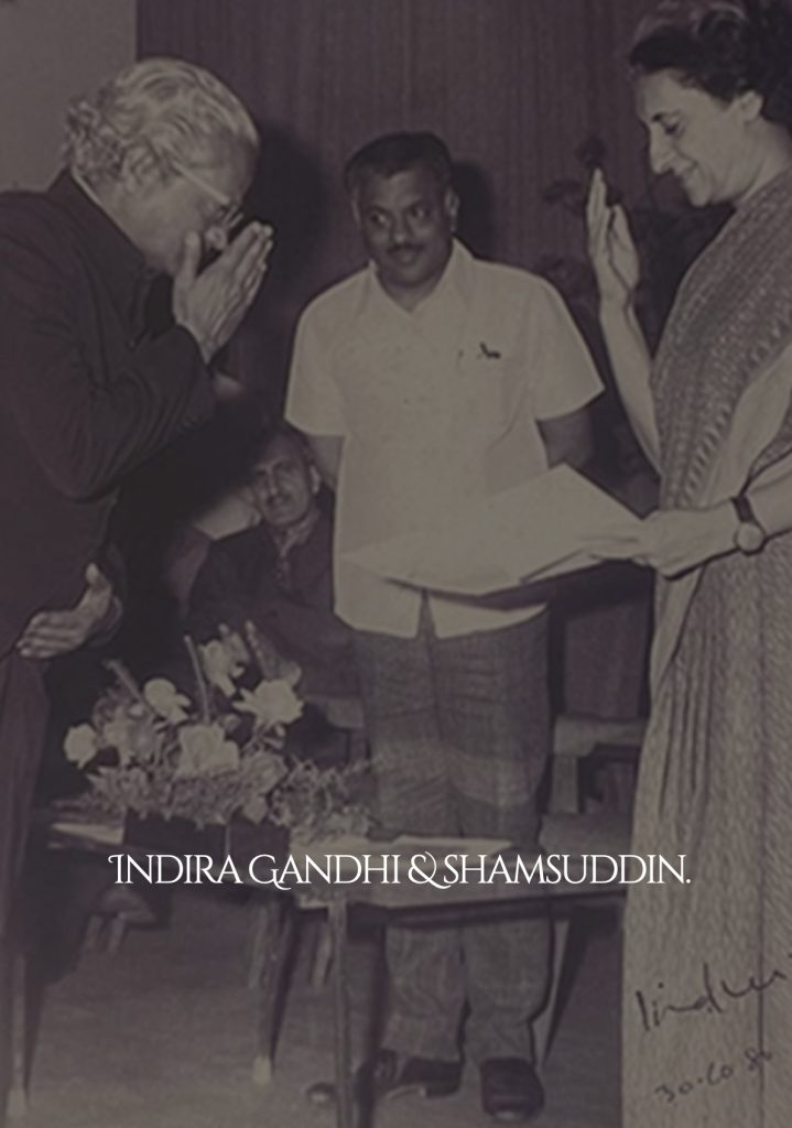 Shams Uddin with Indira Gandhi at an award presentation.
