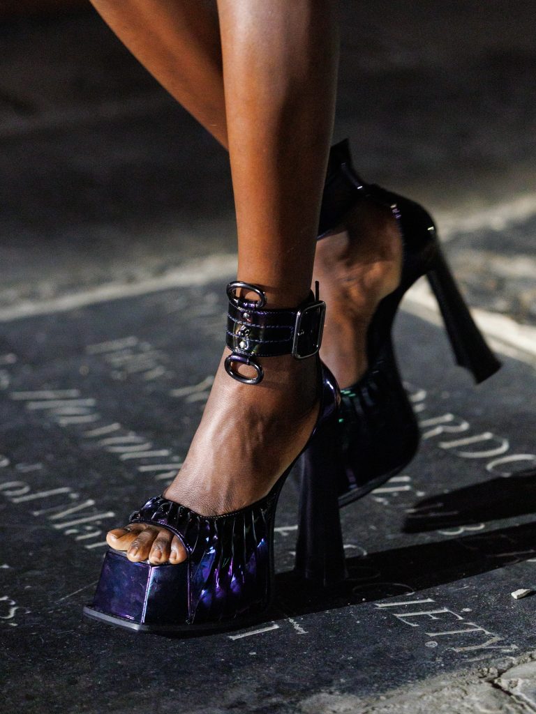 Full-length view of Look 43 featuring high-shine organza with acid botanical motifs