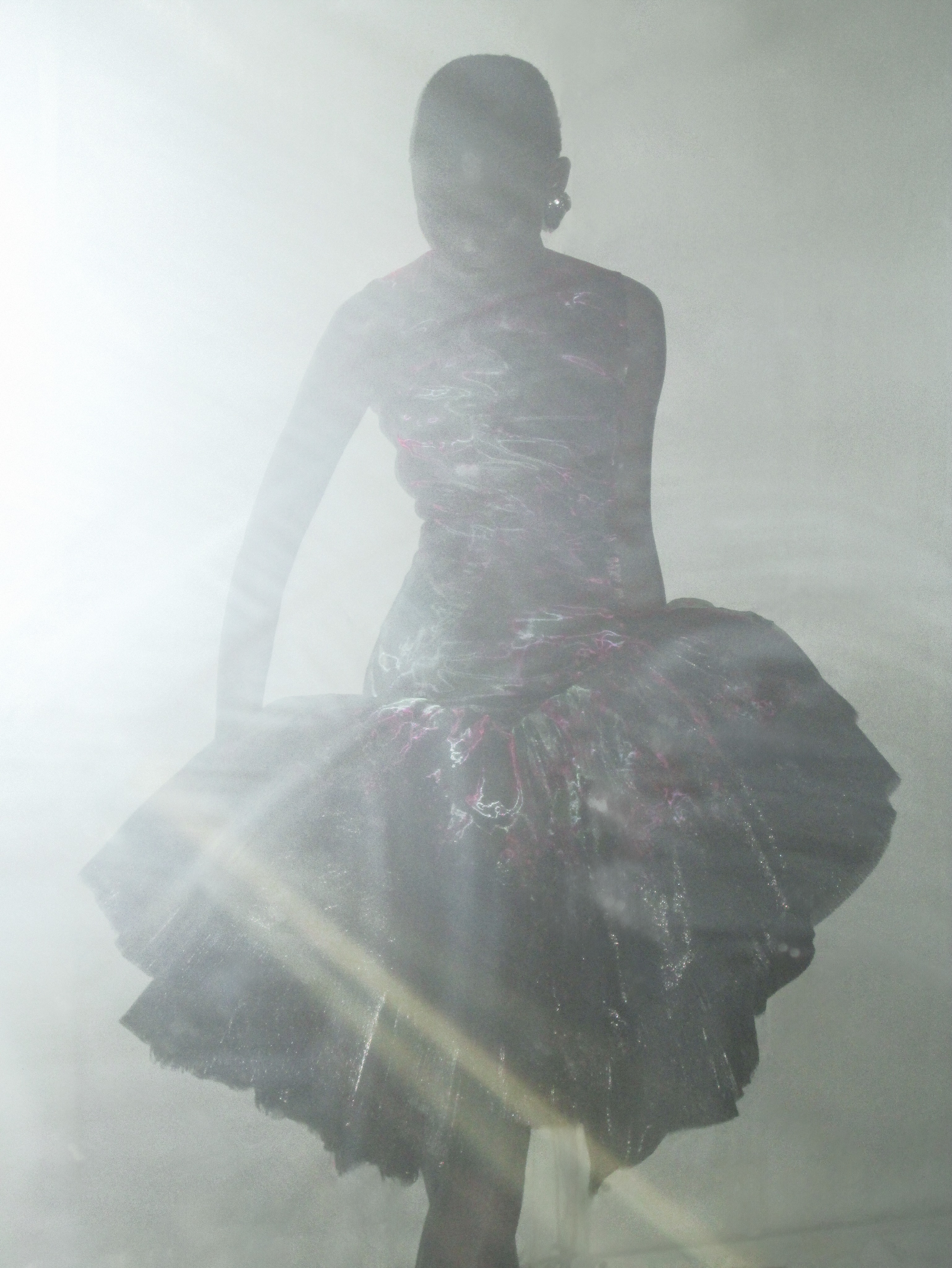 Side profile of glass organza silhouette with printed acid florals and lacquered lace accents