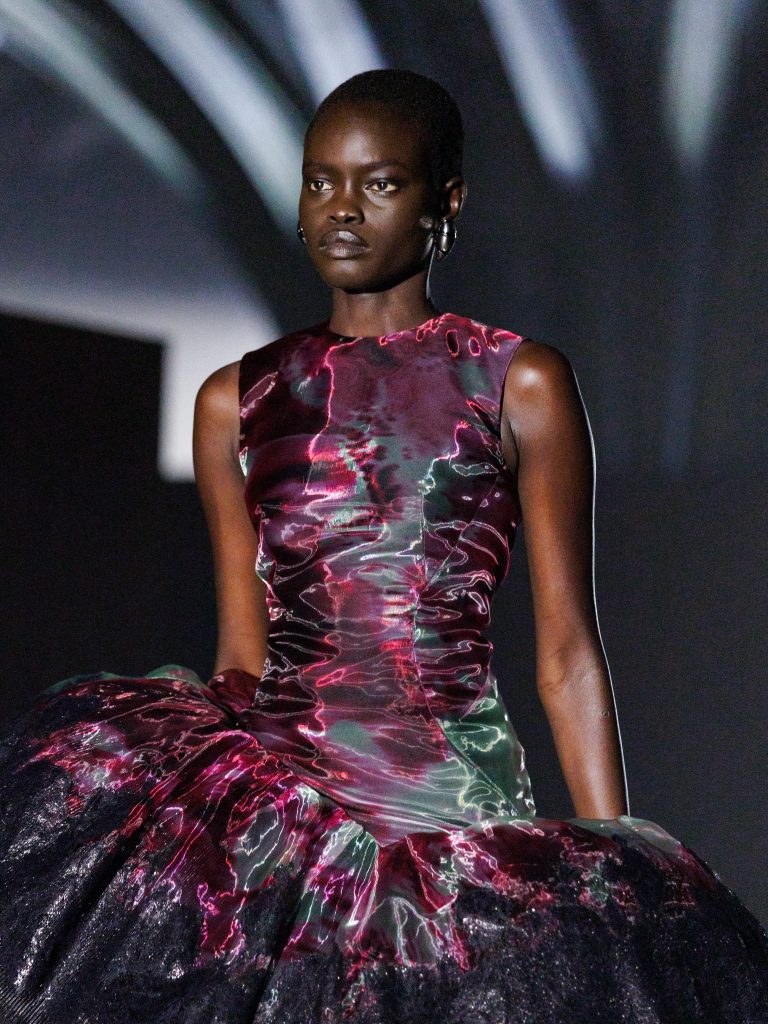 Alexander McQueen Look 43 showcasing interplay between liquid organza and rigid lacquered lace