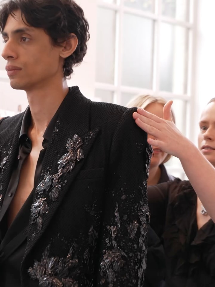 Model in dramatic silhouette with opulent nocturnal jacquard