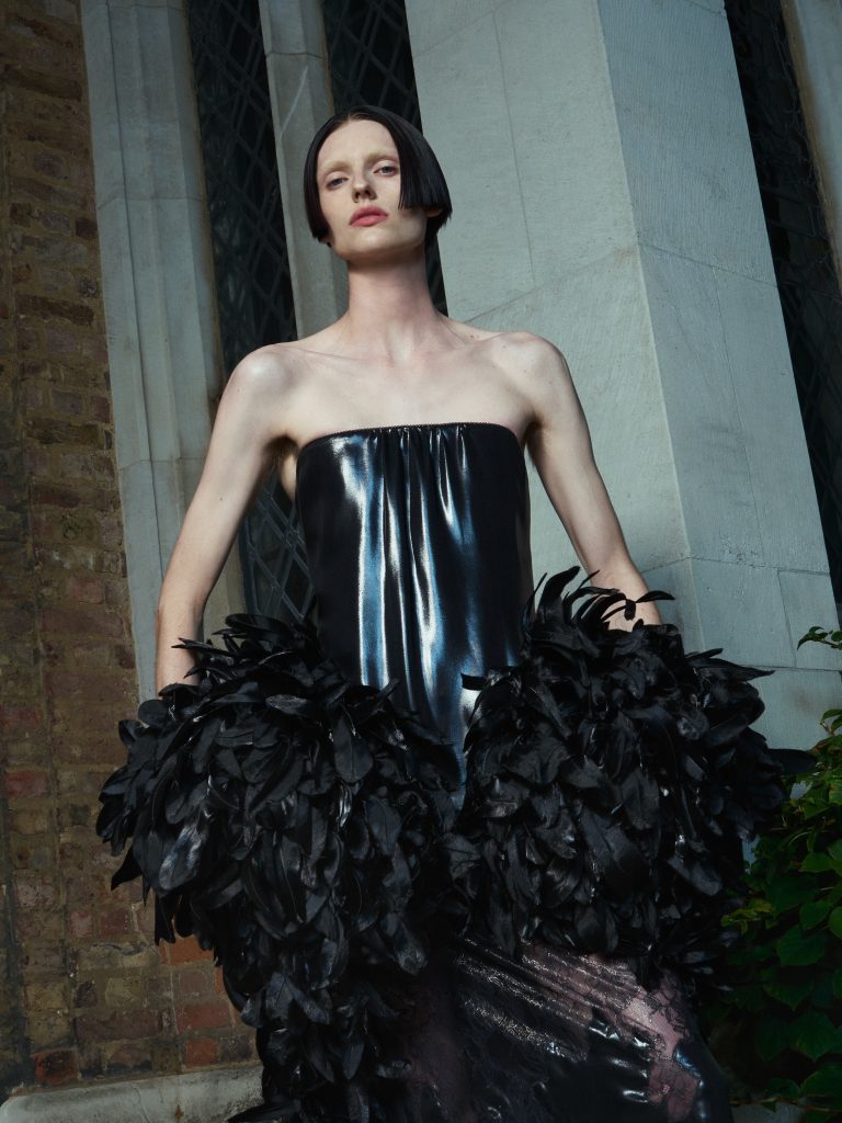 Alexander McQueen explores tactile feather embellishment and architectural drama