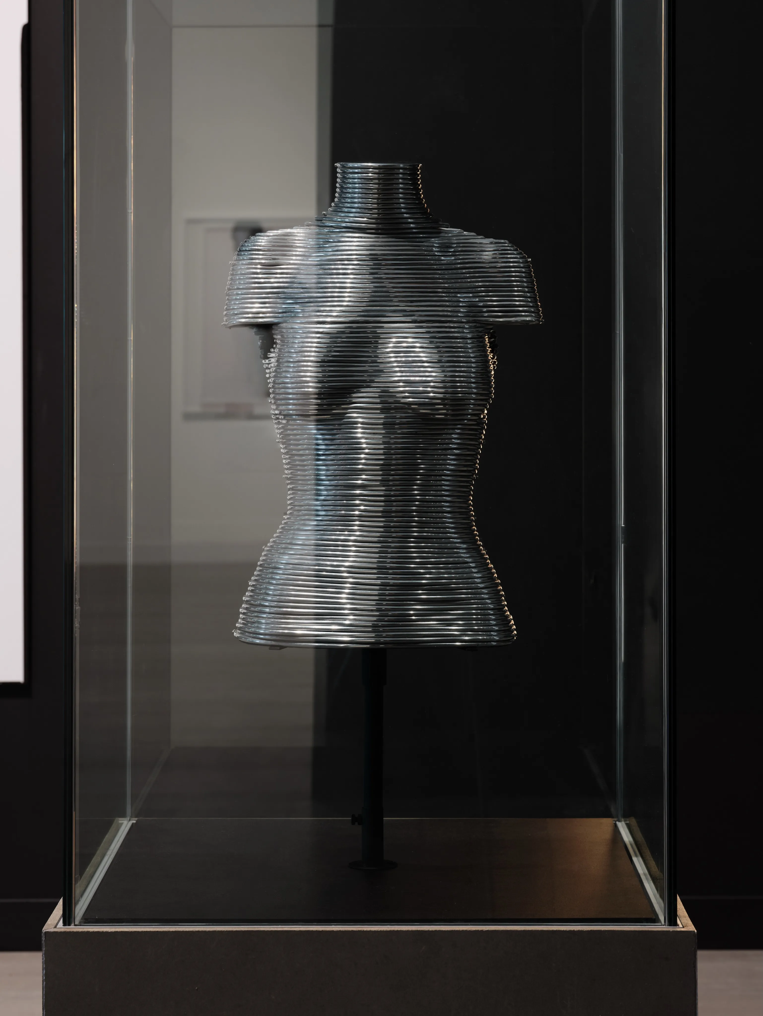 Full view of intricate armour garment by Sarah Harmarnee on exhibition display