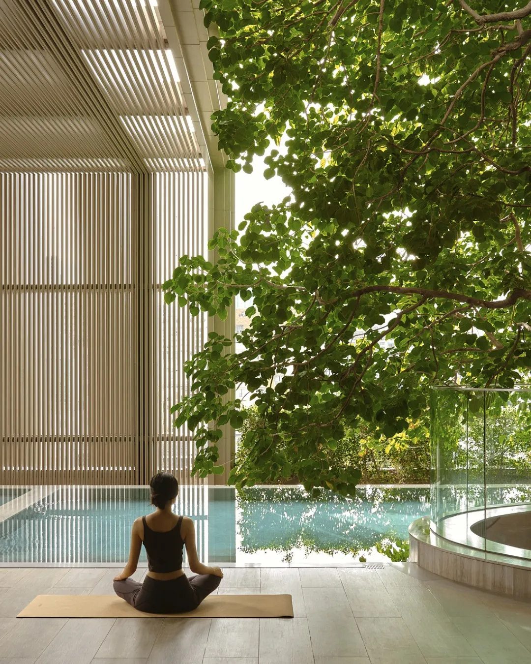 Exterior view of Aman Nai Lert Bangkok nestled within verdant parkland