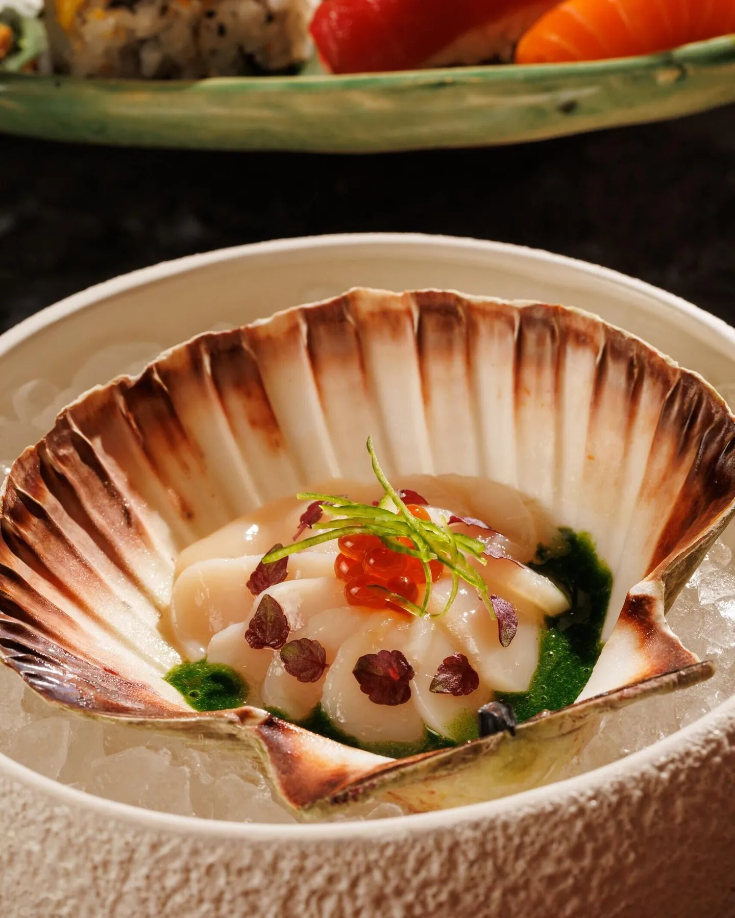 Amazónico Monte Carlo's Viera Tataki featuring seared scallops with shiitake mushrooms, quail eggs and radish pickles, beautifully plated