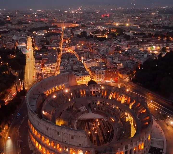 Aroma Restaurant's refined dining room overlooking Rome's iconic monuments within Palazzo Manfredi