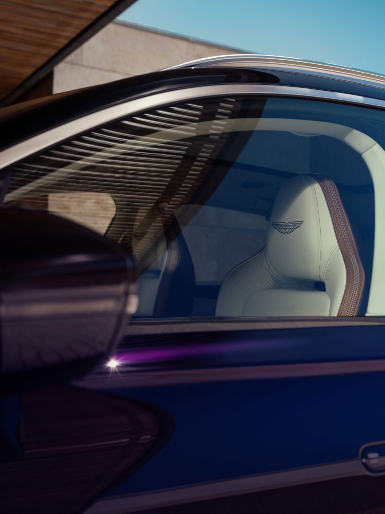 The DBX GT positioned in a dramatic setting, emphasising its grand touring elegance and capability