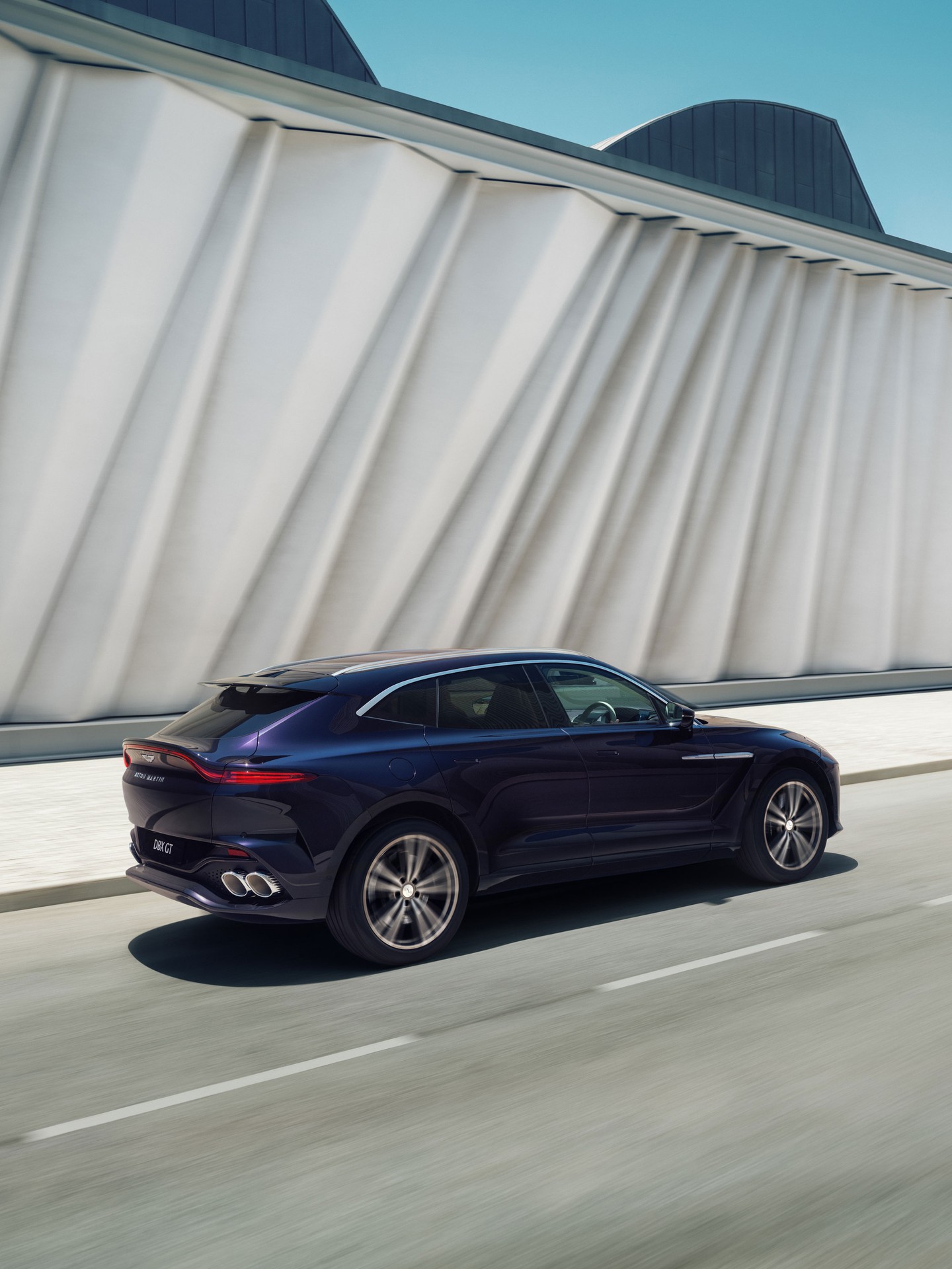 Aston Martin DBX GT showcasing its refined silhouette and powerful stance