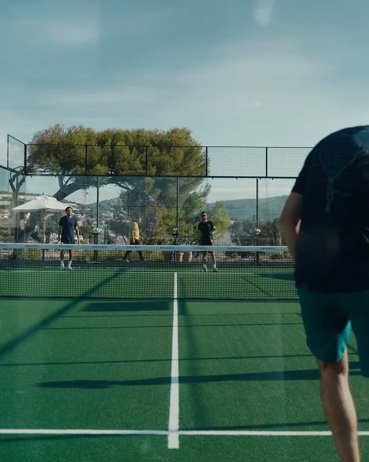 Professional padel player demonstrating technique during tournament play