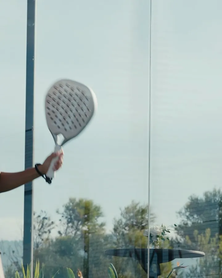Sunset illuminating the padel court and surrounding Riviera landscape