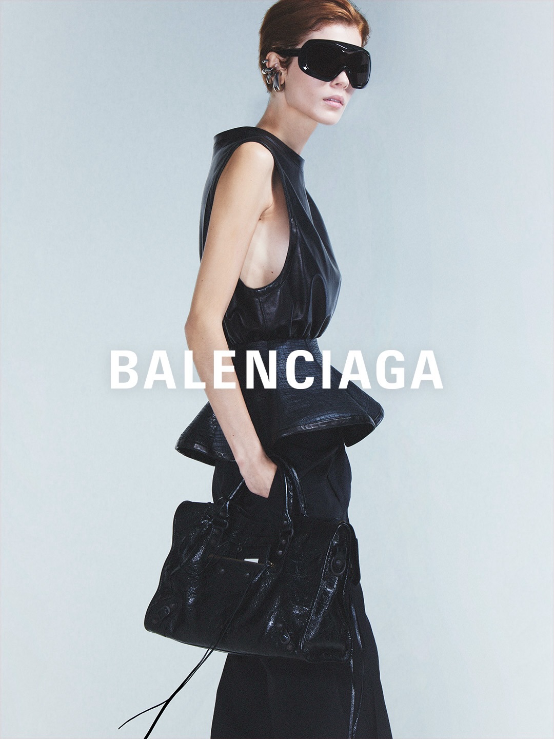 Accessory detail showing refined minimalism in footwear and leather goods