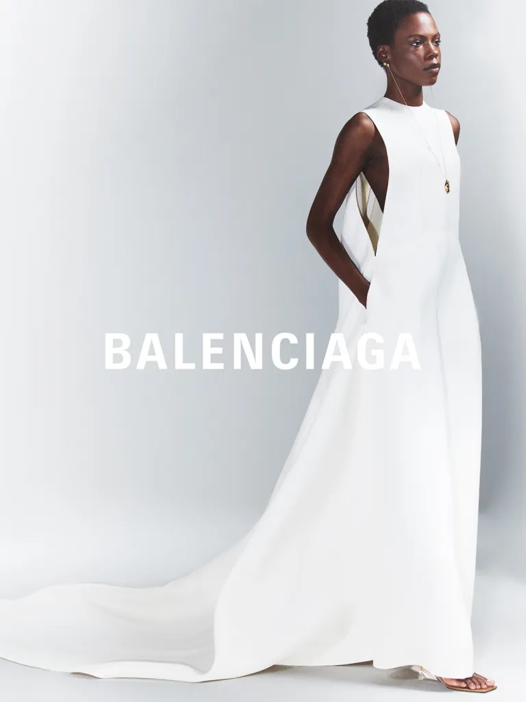 Model wearing high-waisted silhouette with precision tailoring and flowing lower elements