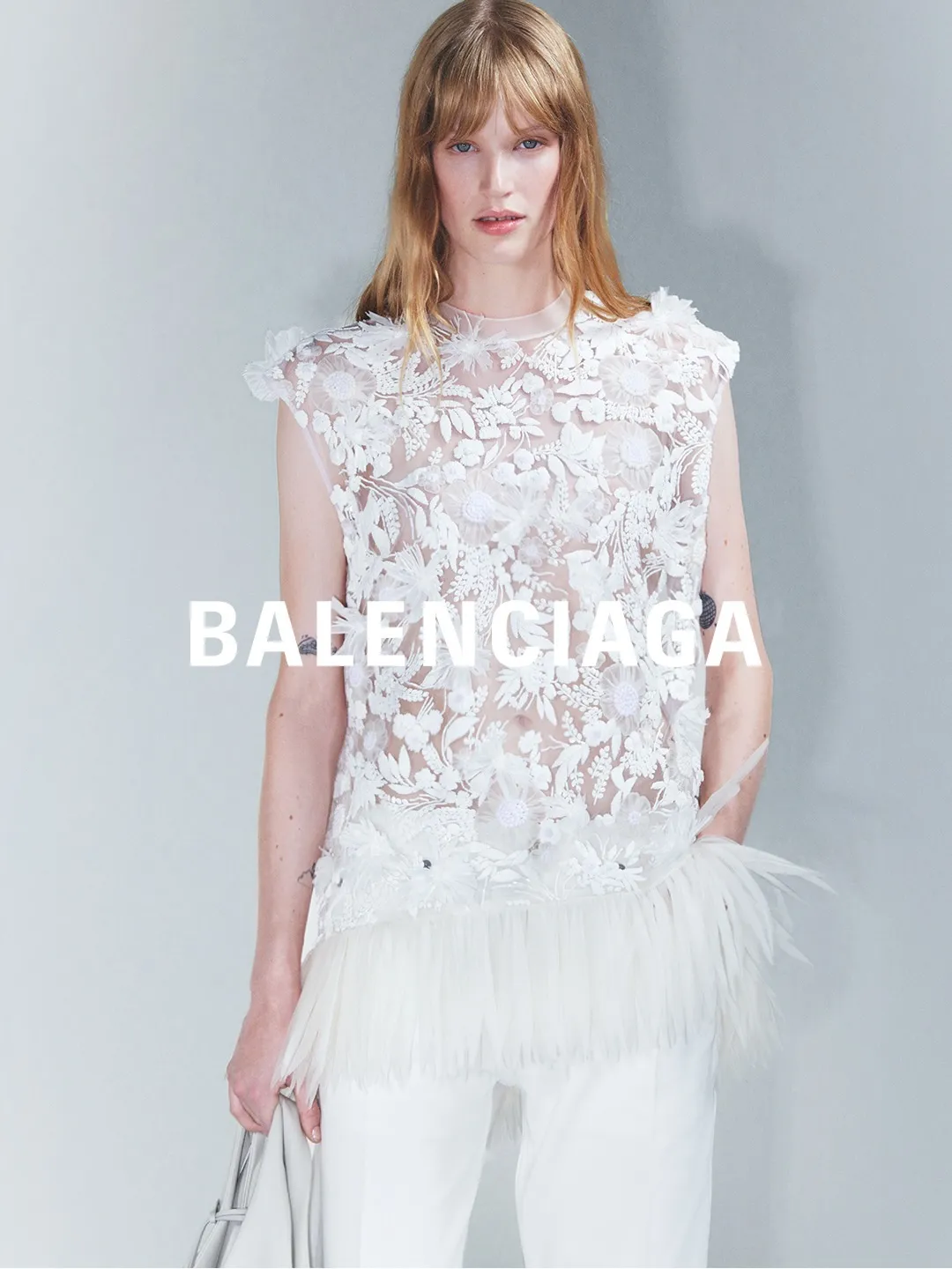 Model in finale piece embodying the collection's balance between structure and freedom