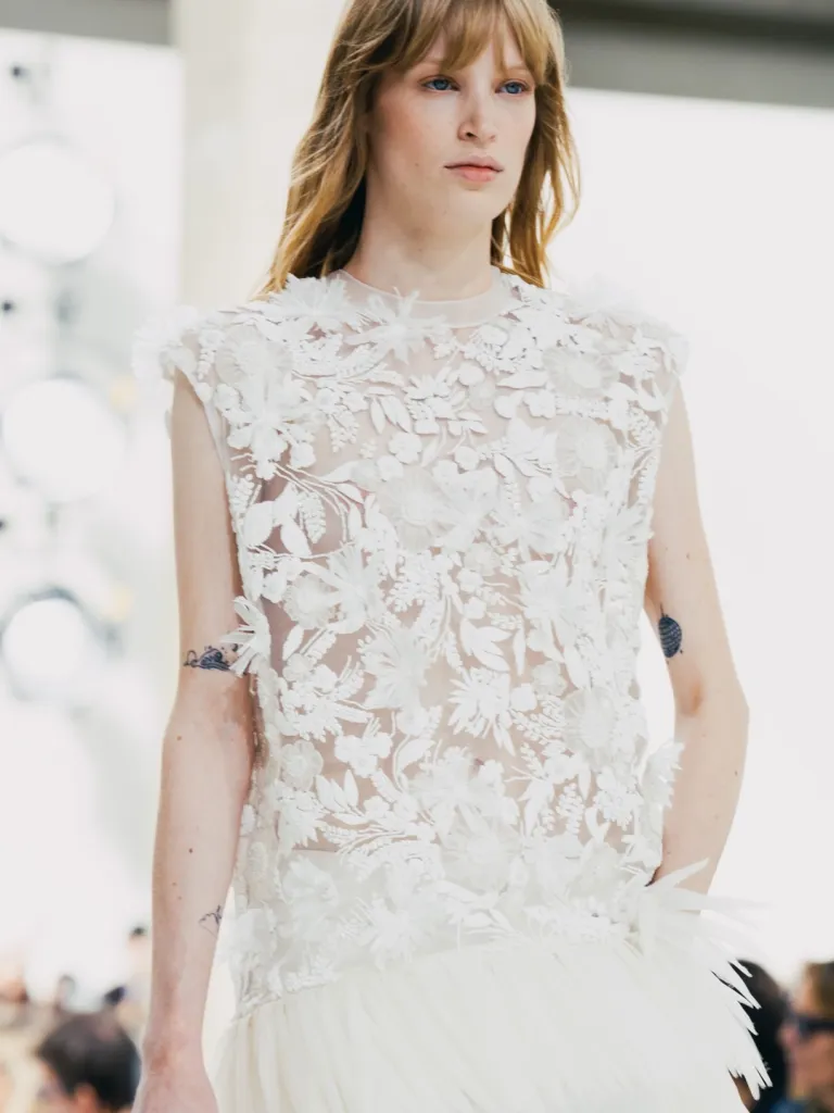 Ethereal blush-toned gown with voluminous construction and organic surface detailing