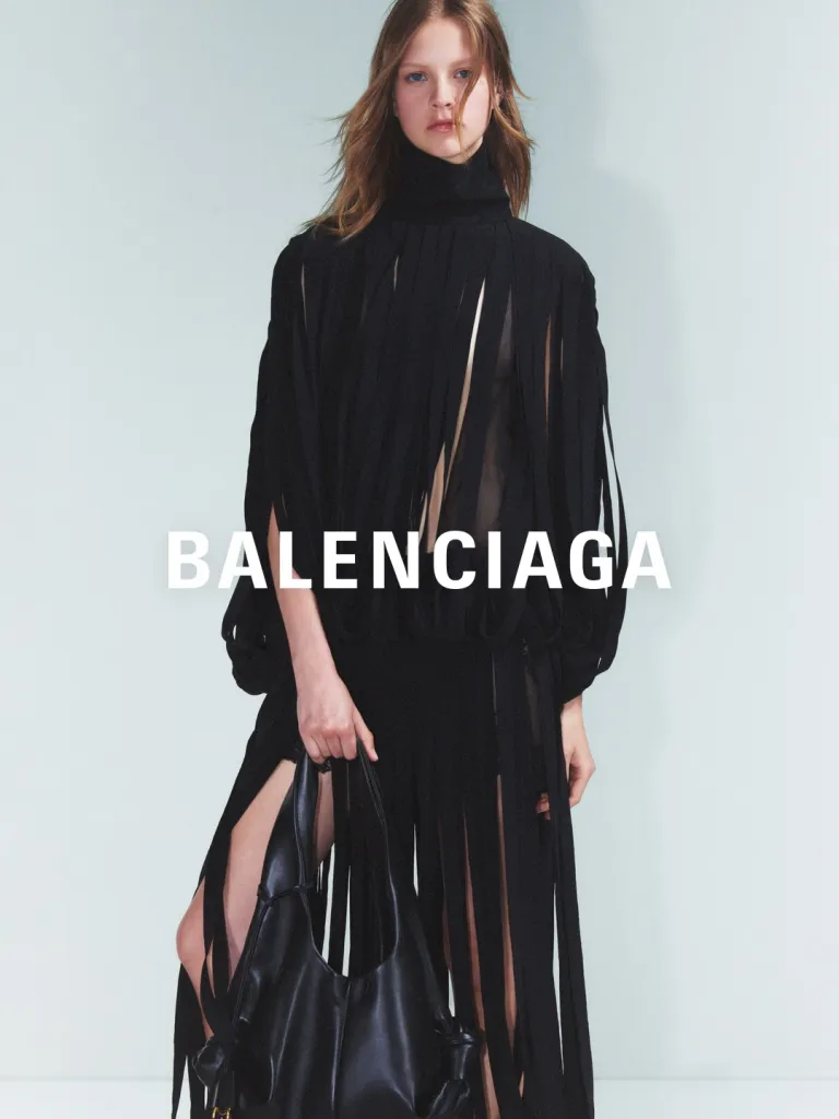 Cascading seafoam and coral toned ensemble demonstrating the collection's emphasis on movement and light