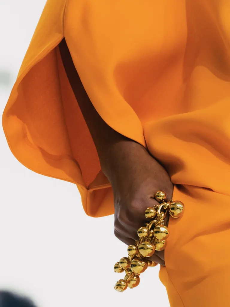 Model in collection piece capturing the luminous, aquatic-inspired aesthetic of Les Coraux de la Liberté