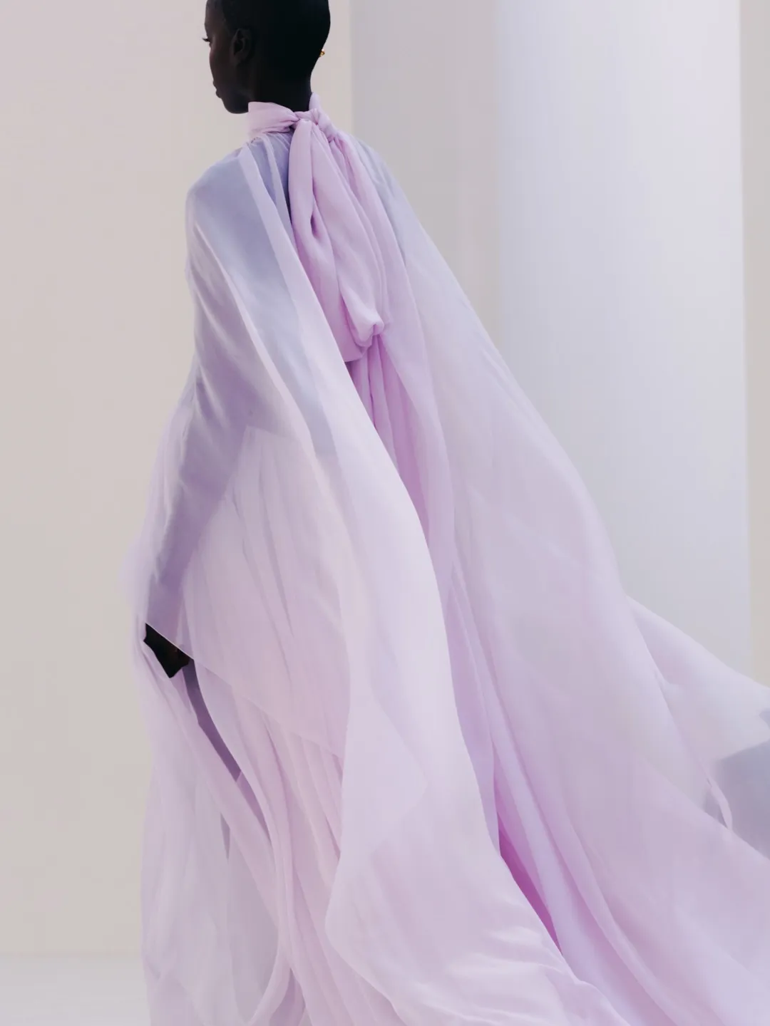 Ensemble capturing the collection's prismatic colour palette in natural daylight