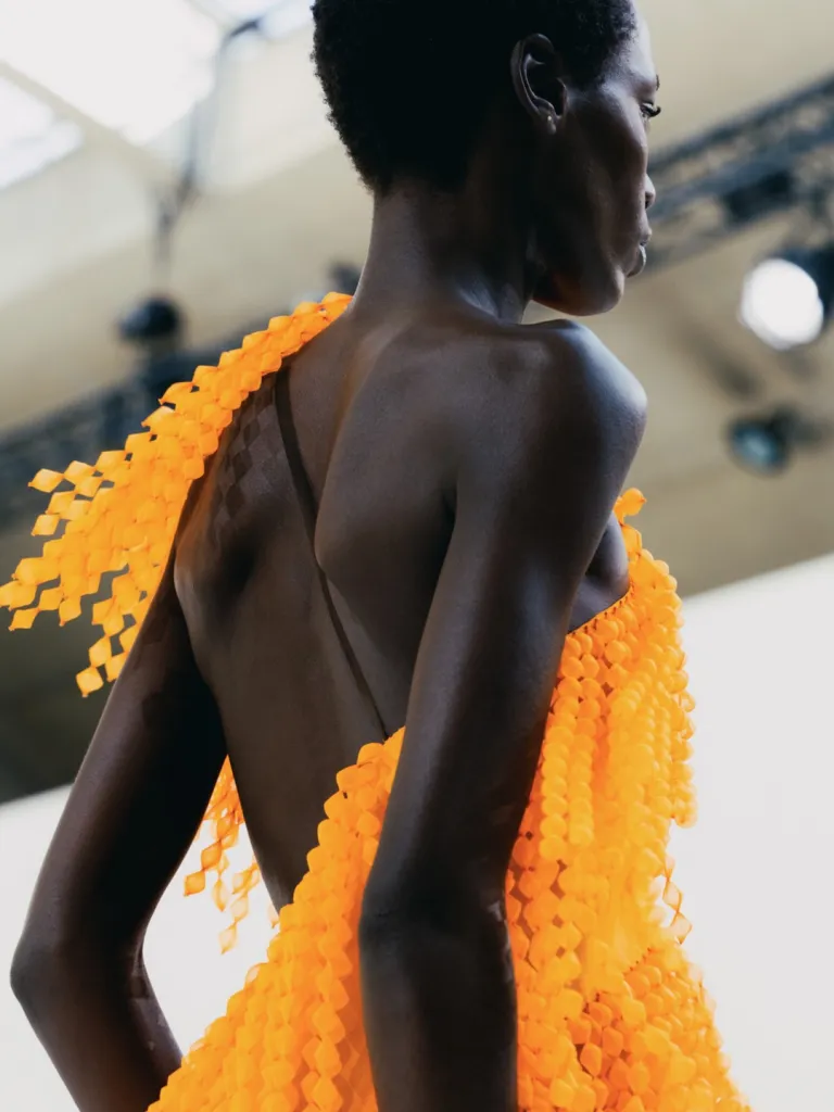 Full-length look showcasing Summer 27's balance between statement dressing and wearable luxury