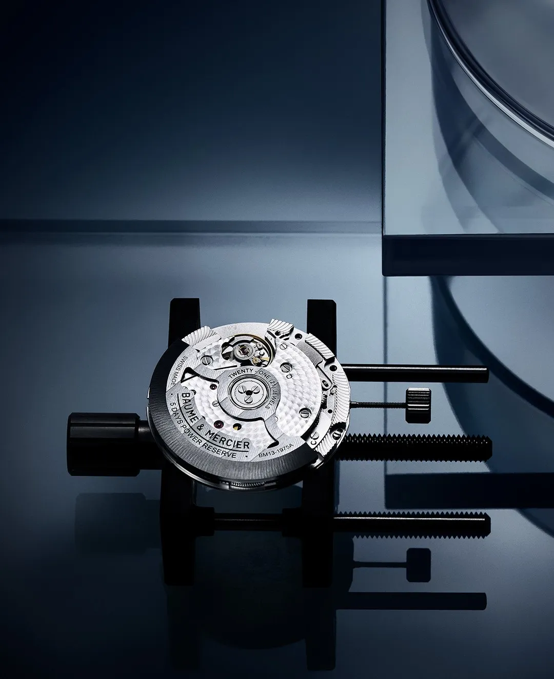 Baume et Mercier Clifton timepiece showcasing the Baumatic movement through transparent caseback