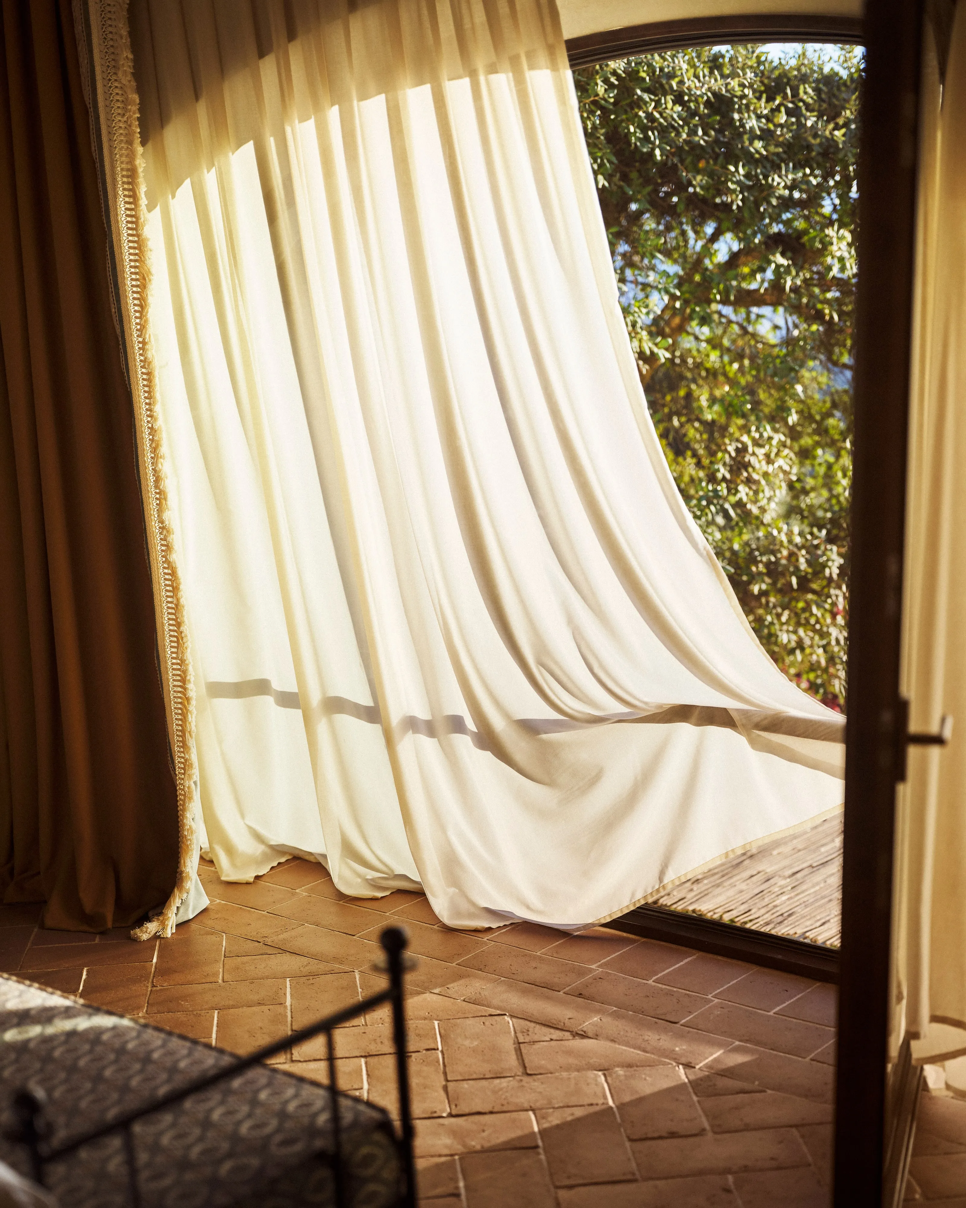 Guest enjoying cappuccino on a suite balcony with panoramic views of Renaissance Florence