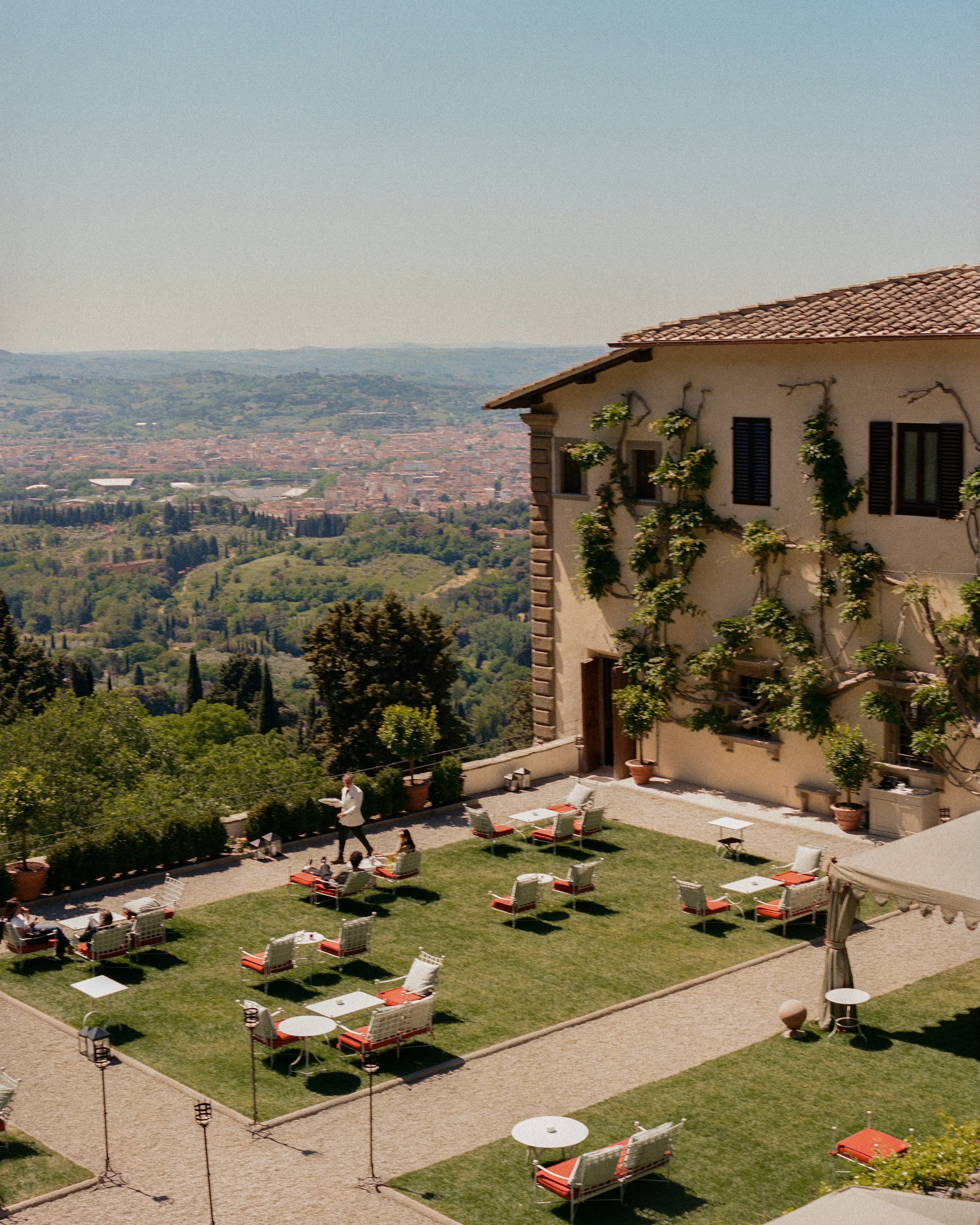 Villa San Michele's breakfast room interior with archways framing views of the city below