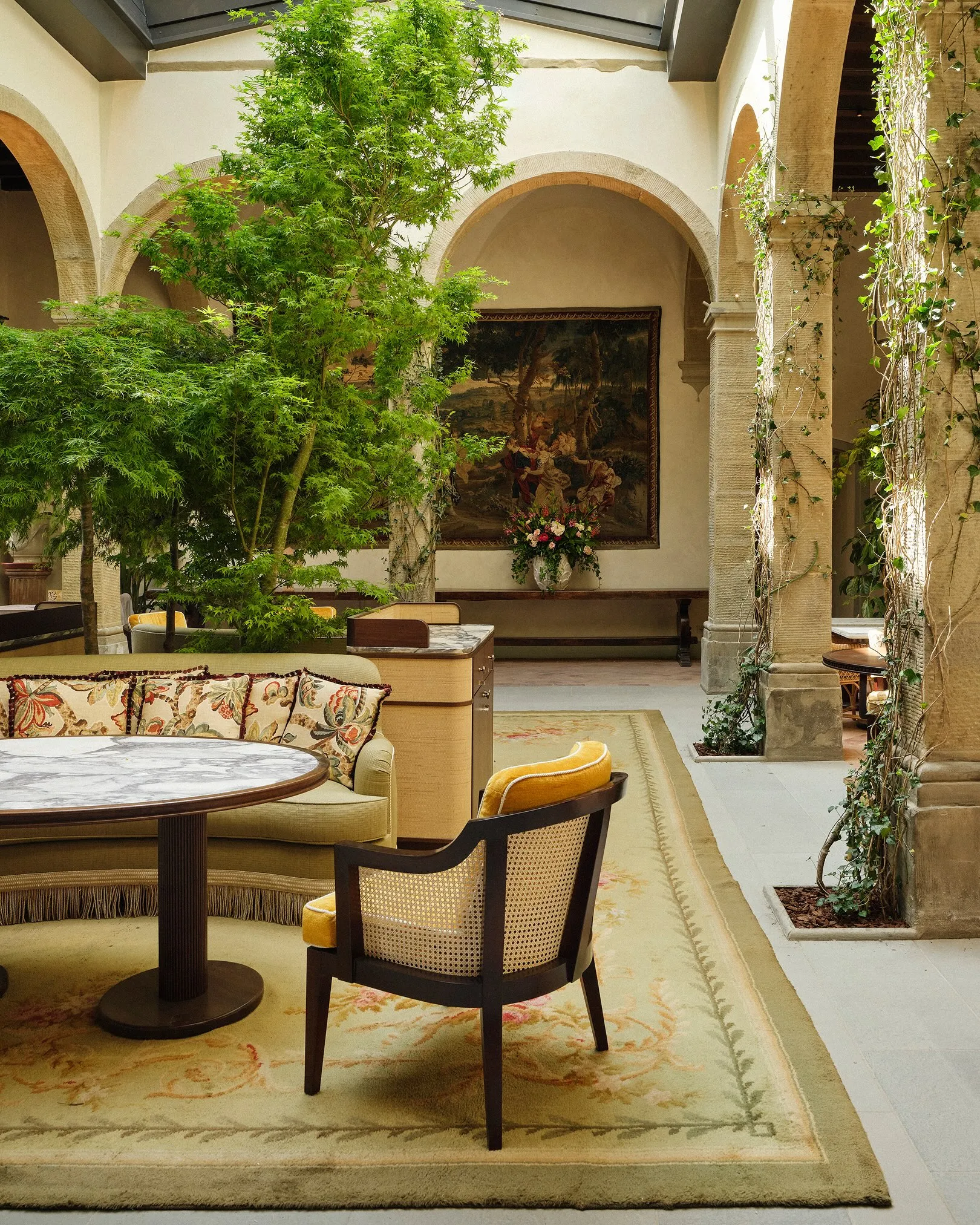 Exterior facade of the restored fifteenth century monastery with Renaissance architecture and manicured gardens
