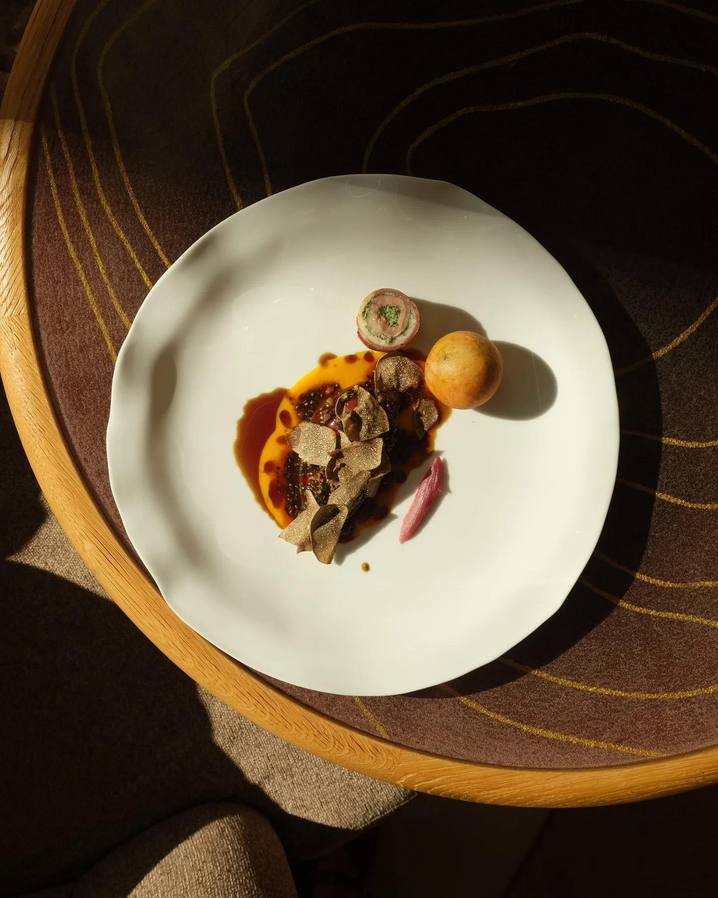 Plated Piedmont pigeon with cacao mucilage and herbes à razié at Blue Bay, Monaco
