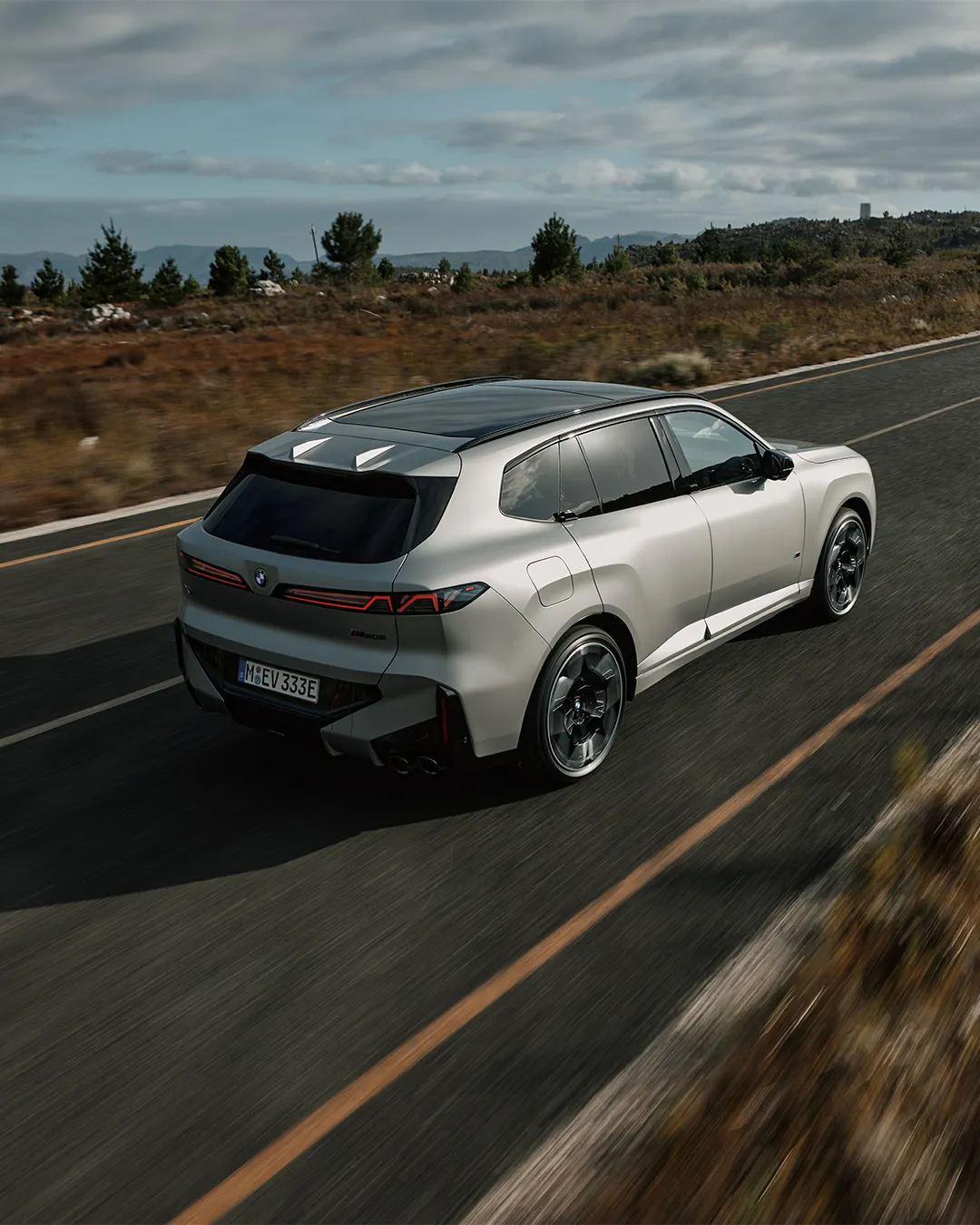 BMW X5 M60e xDrive front three-quarter view showcasing muscular design and elegant proportions